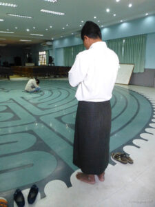 Praying before walking the labyrinth by Jill K H Geoffrion, photographer