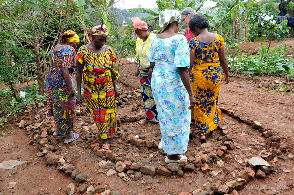 Women walk 3-circuit labyrinth in Buvaku by Jill K H Geoffrion, photographer