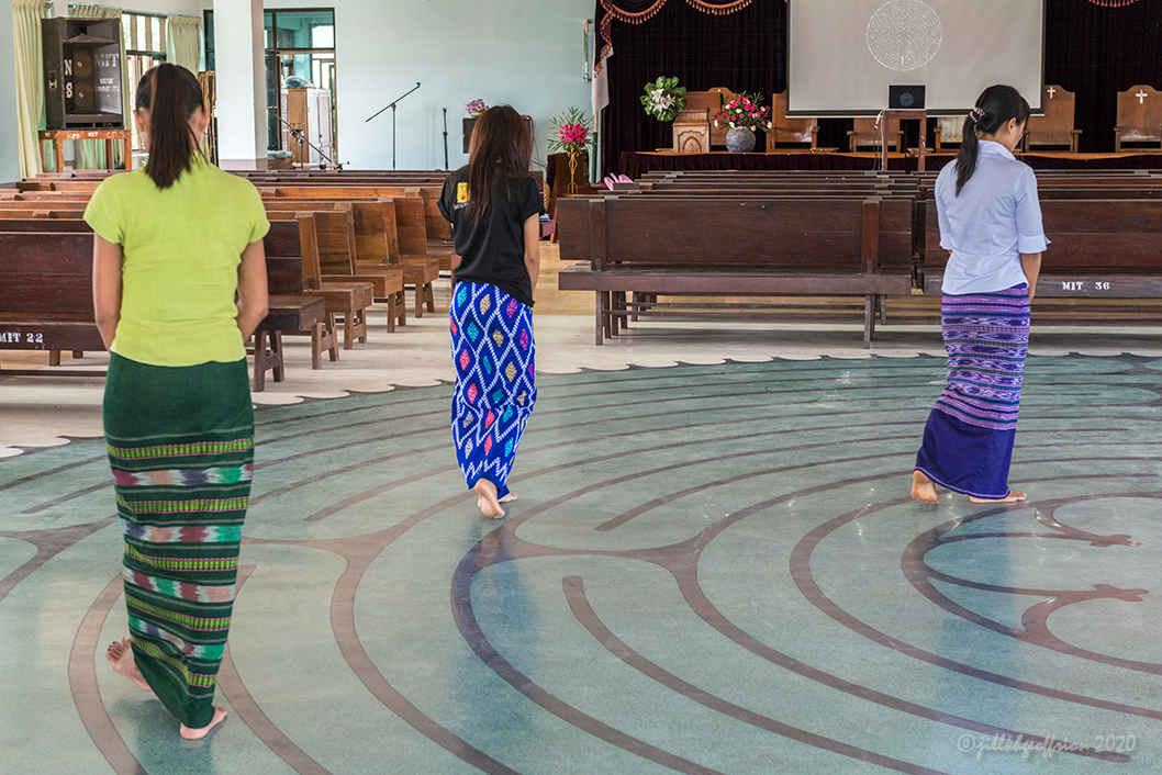 Women walk labyrinth in Myanmar by Jill K H Geoffrion, photographer