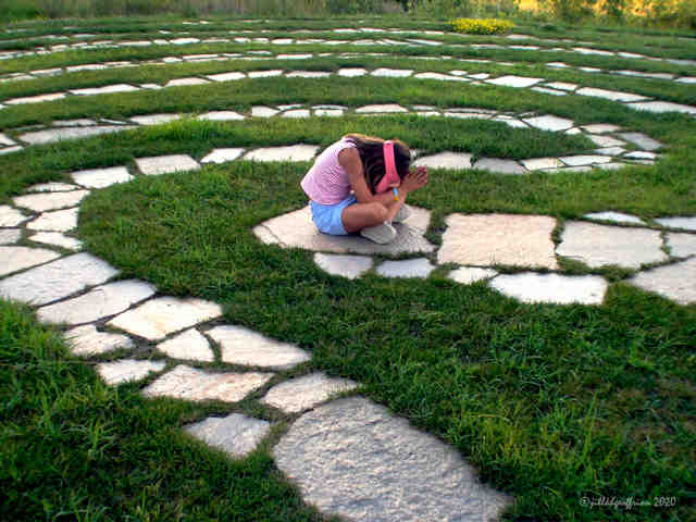 Praying in the center of the labyrinth by Jill K H Geoffrion, photographer